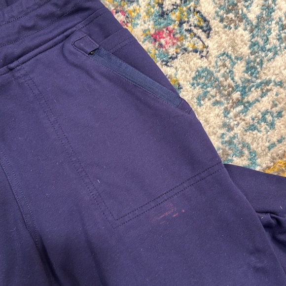 Jaanuu Scrub Set: Tulip Mock-Wrap Top and 10-Pocket Joggers in Navy - Picture 4 of 4